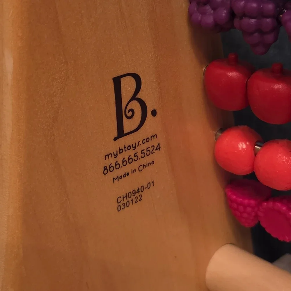 B. Toys Two-Ty Fruity Wooden Abacus Toy Textured Fruit Counting Math Board